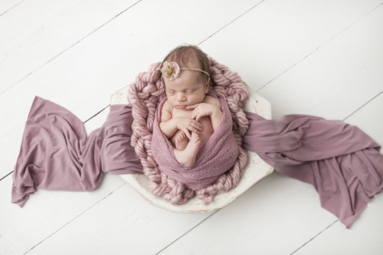 Newborn baby girl in pink wrap-1